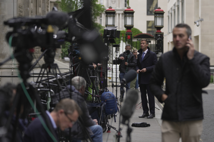 Media waits outside the High Court for the expected arrival of Prince Harry in London, Monday, June 5, 2023. Prince Harry has five active legal cases, three of them involving his battle with the British tabloids. He is expected to testify in London's High Court; if he takes the witness stand, he'll be the first member of the royal family to testify in court since the late 19th century.