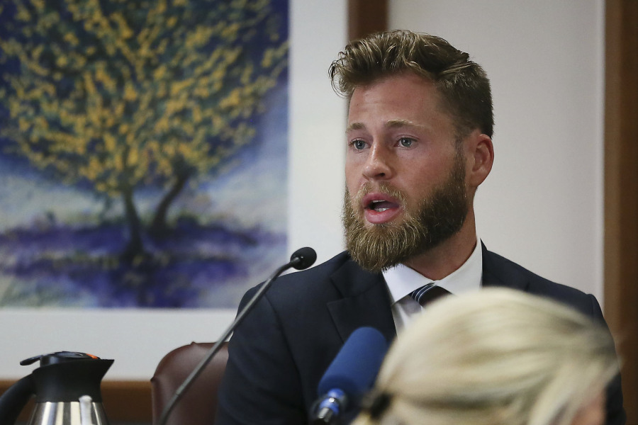 FILE - Owen Shroyer, an InfoWars host and sometimes reporter who is a frequent guest on the Alex Jones Show, testifies during Jones' defamation damages trial at the Travis County Courthouse, July 29, 2022, in Austin, Texas. Infowars host Owen Shroyer, who promoted baseless claims of 2020 election fraud on the far-right internet platform, pleaded guilty on Friday, June 23, 2023, to joining the mob of Donald Trump supporters who rioted at the U.S. Capitol.