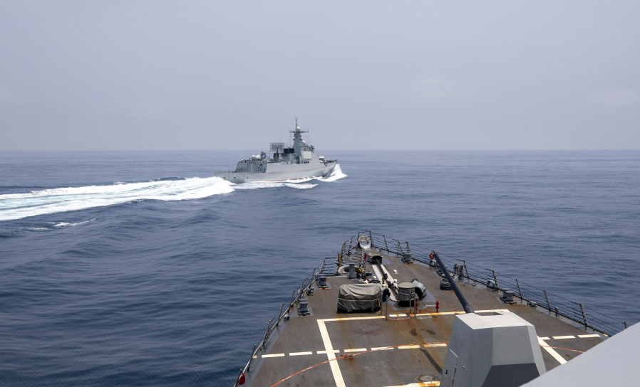 In this photo provided by the U.S. Navy, the USS Chung-Hoon observes a Chinese navy ship conduct what it called an "unsafe" Chinese maneuver in the Taiwan Strait, Saturday, June 3, 2023, in which the Chinese navy ship cut sharply across the path of the American destroyer, forcing the U.S. ship to slow to avoid a collision. The incident occurred as the American destroyer and Canadian frigate HMCS Montreal were conducting a so-called "freedom of navigation" transit of the strait between Taiwan and mainland China.  (Mass Communication Specialist 1st Class Andre T. Richard/U.S.