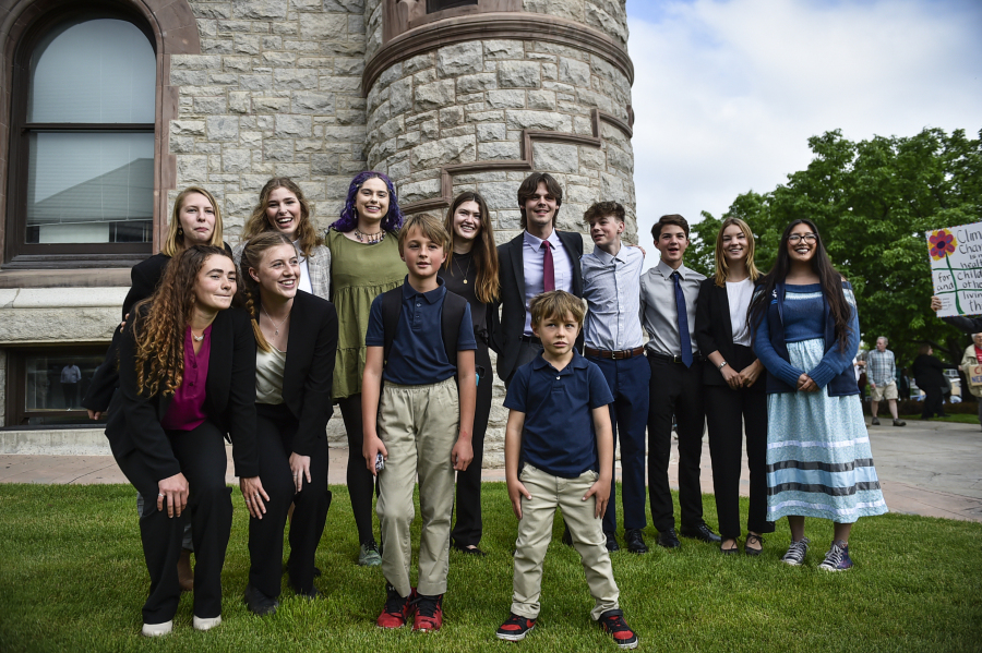 Youth plaintiffs in the climate change lawsuit, Held vs. Montana, pose  outside the Lewis and Clark County Courthouse in Helena, Mont., on Monday, June 12, 2023.
