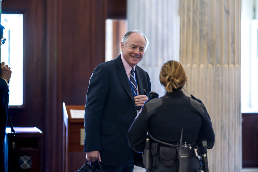 Steve Ricchetti, one of the top negotiators for President Joe Biden on the debt limit crisis, is greeted by a Capitol Police office after he passed through security to return to closed-door mediation, at the Capitol in Washington, Tuesday, May 23, 2023. (AP Photo/J.