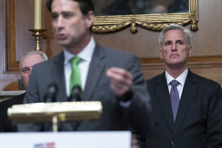 Speaker of the House Kevin McCarthy of Calif., looks on as Rep. Garret Graves, R-La., speaks at a news conference Wednesday after the House passed the debt ceiling bill at the Capitol in Washington. The bill now goes to the Senate.
