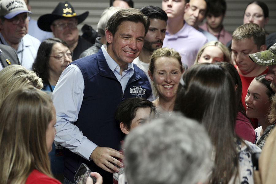 Florida Gov. Ron DeSantis poses for a picture with voters after giving a speech at a rally in Council Bluffs, Iowa, Wednesday. Several hundred people filled half of an event center to listen to DeSantis speak in his first trip to Iowa since announcing his presidential campaign.