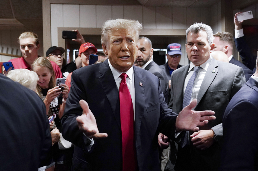 FILE - Former President Donald Trump greets supporters before speaking at the Westside Conservative Breakfast, June 1, 2023, in Des Moines, Iowa. As Ron DeSantis embarked on the first official week of his presidential candidacy, the Florida governor repeatedly hit his chief rival, Trump, from the right.
