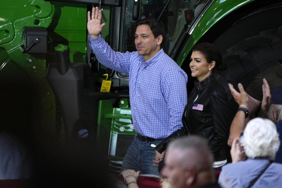 Republican presidential candidate and Florida Gov. Ron DeSantis and his wife, Casey, walk to the stage during U.S. Sen. Joni Ernst's Roast and Ride, Saturday, June 3, 2023, in Des Moines, Iowa.