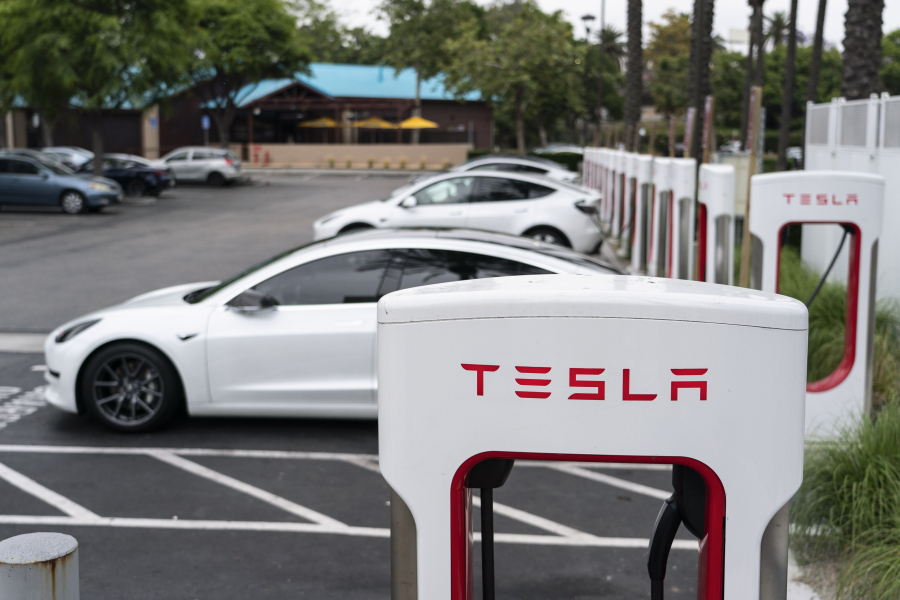 Tesla electric vehicles are charged at a charging station in Anaheim, Calif., Friday, June 9, 2023. Owners of General Motors and Ford electric vehicles will be able charge at many of Tesla's large network of stations across the U.S. starting next year. (AP Photo/Jae C.
