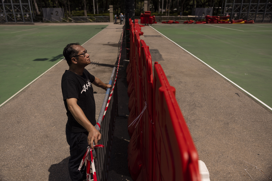 Richard Tsoi, former leader of now-disbanded Hong Kong Alliance in Support of Patriotic Democratic Movements of China, poses for photographs next to a closed pitch at Victoria Park in Hong Kong, Monday, May 29, 2023. As the 34th anniversary of China's Tiananmen Square crackdown approaches Sunday, June 4, many in Hong Kong are trying to mark the day in their own ways in the shadow of a law that prosecuted many leading activists in the city's pro-democracy movement.