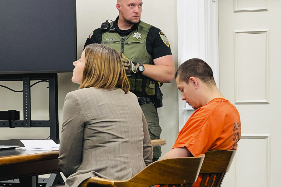 Majorjon Kaylor, 31, right, sits next to defense attorney Lisa Chesebro in a Wallace, Idaho, courtroom on Tuesday, June 20, 2023, during his first appearance on four murder charges. Prosecutors say Kaylor shot and killed his neighbors, including a child, Sunday evening.