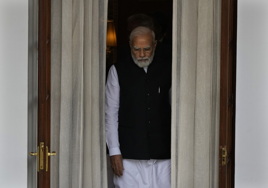 Indian Prime Minister Narendra Modi leaves to receive Nepal's Prime Minister Pushpa Kamal Dahal before their meeting in New Delhi, India, Thursday, June 1, 2023. Dahal arrived Wednesday on a state visit, his first trip abroad since taking power in December last year.