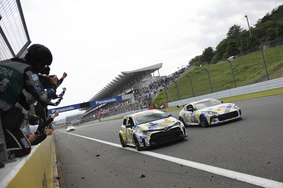 In this photo released by Toyota Motor Corp., Toyota's Corolla racing car, front left, powered by liquid hydrogen runs on the racing course during a 24-hour race at Fuji International Speedway in Oyama town, some 100 kilometers (62 miles) southwest of Tokyo, Sunday, May 28, 2023. The hydrogen-fueled Corolla has made its racing debut, part of a move to bring the futuristic technology into the racing world and to demonstrate Toyota's resolve to develop green vehicles. (Toyota Motor Corp.