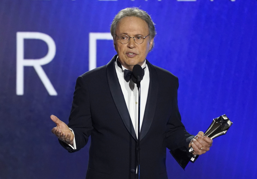 FILE - Billy Crystal accepts the lifetime achievement award at the 27th annual Critics Choice Awards on March 13, 2022, at the Fairmont Century Plaza Hotel in Los Angeles.