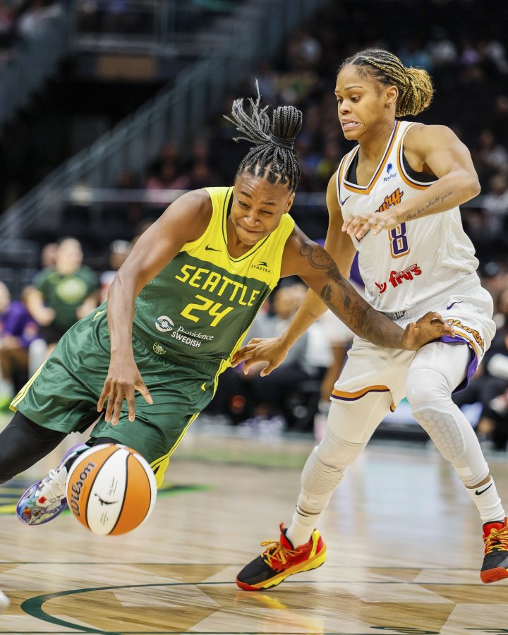 Seattle Storm guard Jewell Loyd (24) drives, drawing a foul from Phoenix Mercury guard Moriah Jefferson (8), during a WNBA basketball game Saturday, June 24, 2023, at Climate Pledge Arena in Seattle.