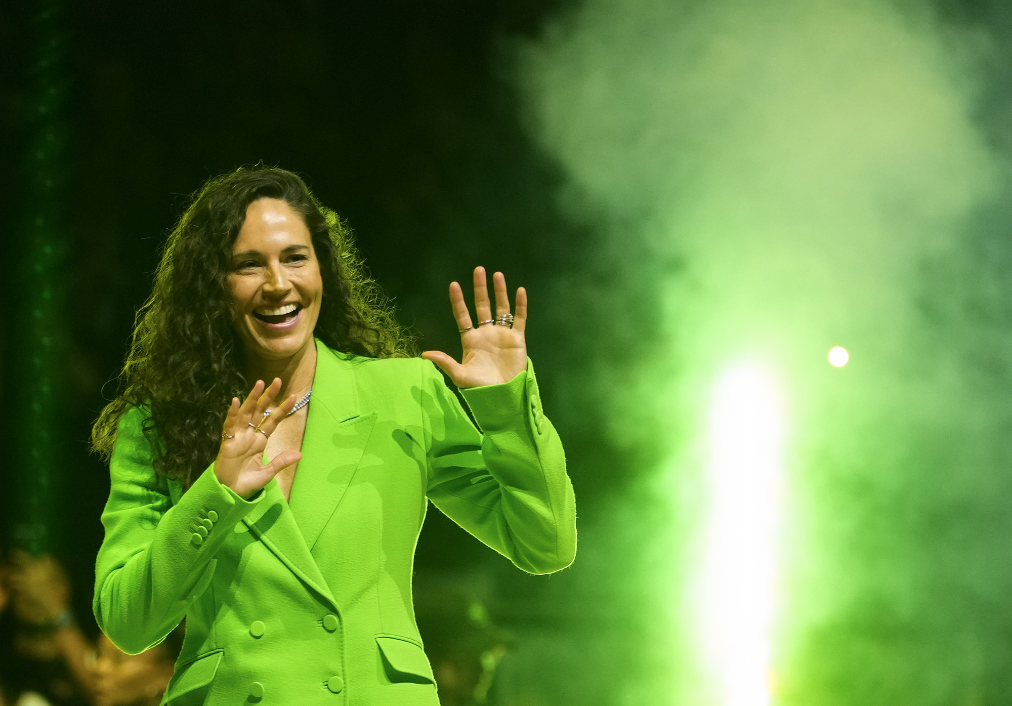 Former Seattle Storm guard Sue Bird waves as she enters the court during her jersey retirement ceremony following a WNBA basketball game between the Storm and the Washington Mystics, Sunday, June 11, 2023, in Seattle.