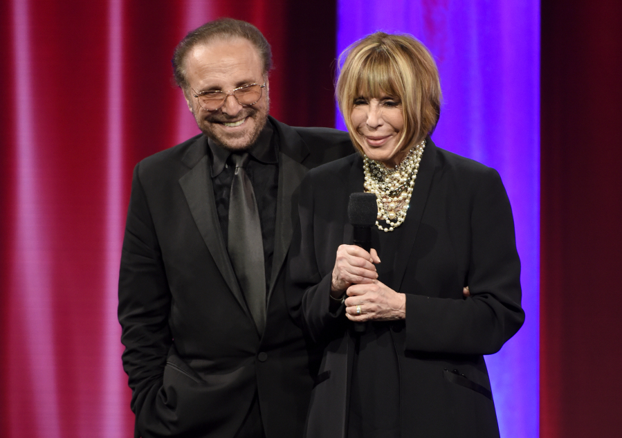 FILE - Barry Mann, left, and Cynthia Weil accept the BMI Icon award at the 64th annual BMI Pop Awards on, May 10, 2016, in Beverly Hills, Calif. Weil, a Grammy-winning lyricist of great range and endurance who enjoyed a decades-long partnership with husband Barry Mann and helped write "You've Lost That Lovin' Feeling," "On Broadway," "Walking in the Rain" and dozens of other hits, has died at age 82. Weil and Mann, married in 1961, were one of popular music's most successful teams.