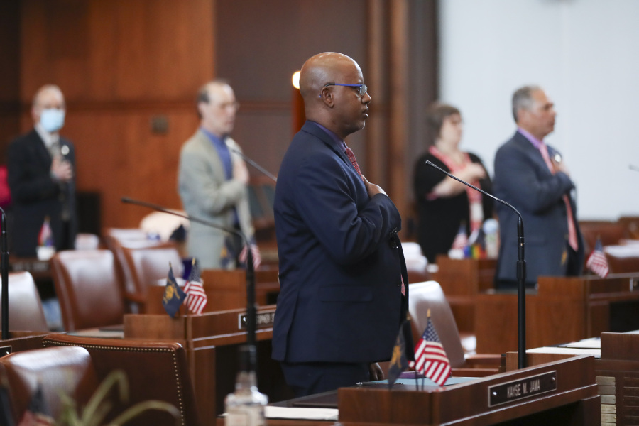 Democratic Sen. Kayse Jama stands for the "Pledge of Allegiance" during a Senate session at the Oregon State Capitol in Salem, Ore., Tuesday, June 6, 2023. The Senate failed to achieve a quorum because of the continued Republican-led walkout.