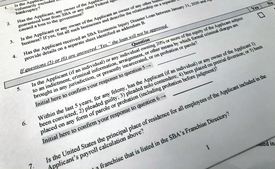 FILE - A portion of a Small Business Administration Paycheck Protection Program Borrower Application Form is seen in Washington on Tuesday, April 21, 2020. An Associated Press analysis published on Monday, June 12, 2023, found that fraudsters potentially stole more than $280 billion in COVID-19 relief funding; another $123 billion was wasted or misspent. Combined, the loss represents a jarring 10 percent of the total $4.2 trillion the U.S. government has so far disbursed in COVID-relief aid.