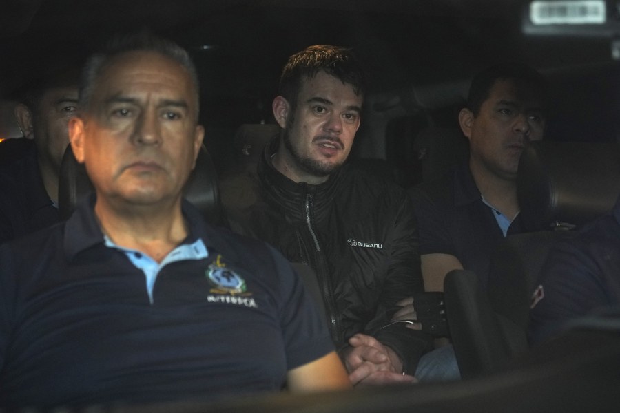 Dutch citizen Joran van der Sloot, center, is driven in a police vehicle from the Ancon I maximum-security prison, outskirts of Lima, Peru, early Thursday, June 8, 2023. The main suspect in the unsolved 2005 disappearance of American student Natalee Holloway on the Caribbean island of Aruba is expected to be extradited Thursday from Peru to the United States.