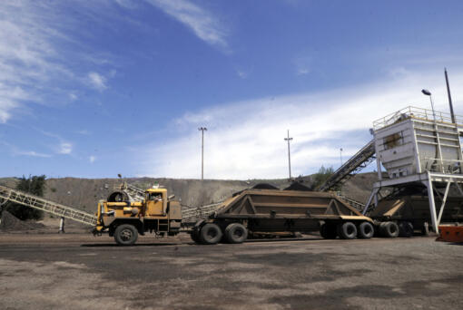 FILE - A truck takes on a load of phosphate ore at a hopper near Monsanto Company's South Rasmussen Mine Operation on July 16, 2009 near Soda Springs, Idaho. U.S. District Judge B. Lynn Winmill' has yanked approval for a phosphate mining project in southeastern Idaho, saying federal land managers in the Trump administration didn't in part properly consider the mine's impact on sage grouse. The judge's Friday, June 2, 2023, decision came five months after he found fault with the way the U.S. Bureau of Land Management approved the Caldwell Canyon Mine.