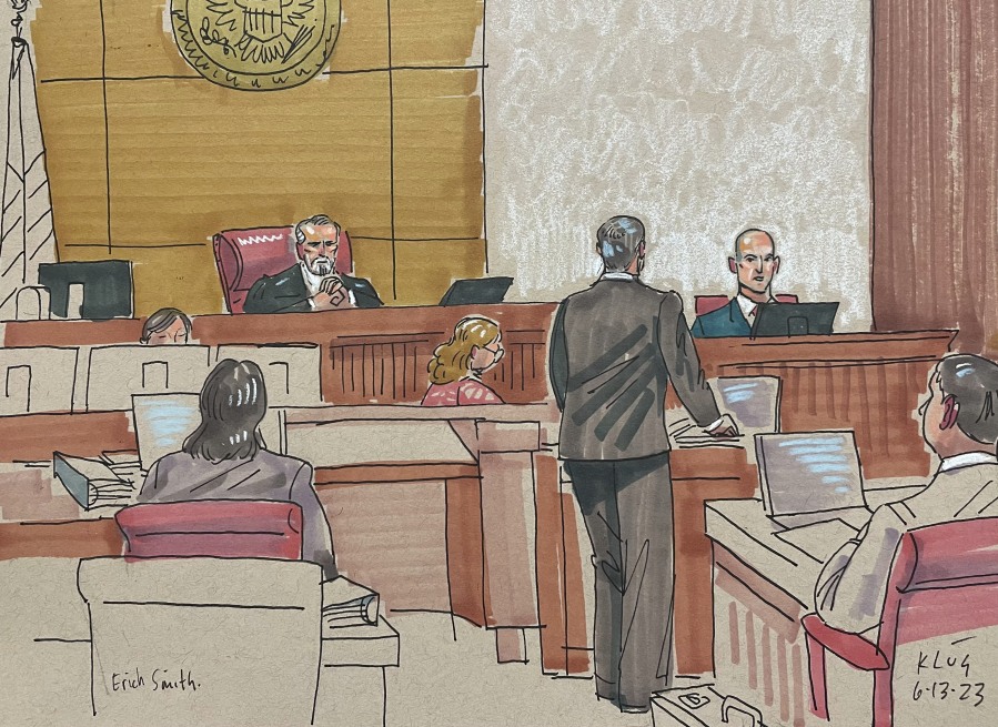In this courtroom sketch, Erich Smith testifies Tuesday, June 13, 2023, in Pittsburgh, in the federal trial of Robert Bowers. Bowers is accused of shooting to death 11 worshippers in a synagogue more than four years ago, the deadliest antisemitic attack in U.S. history.