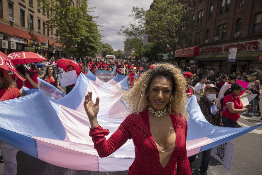 Participants hold a large transgender flag during the 31st annual Queens Pride Parade and Multicultural Festival, Sunday, June. 4, 2023, in New York. Transgender and nonbinary people are front and center this year at Pride festivals where they've often been sidelined.