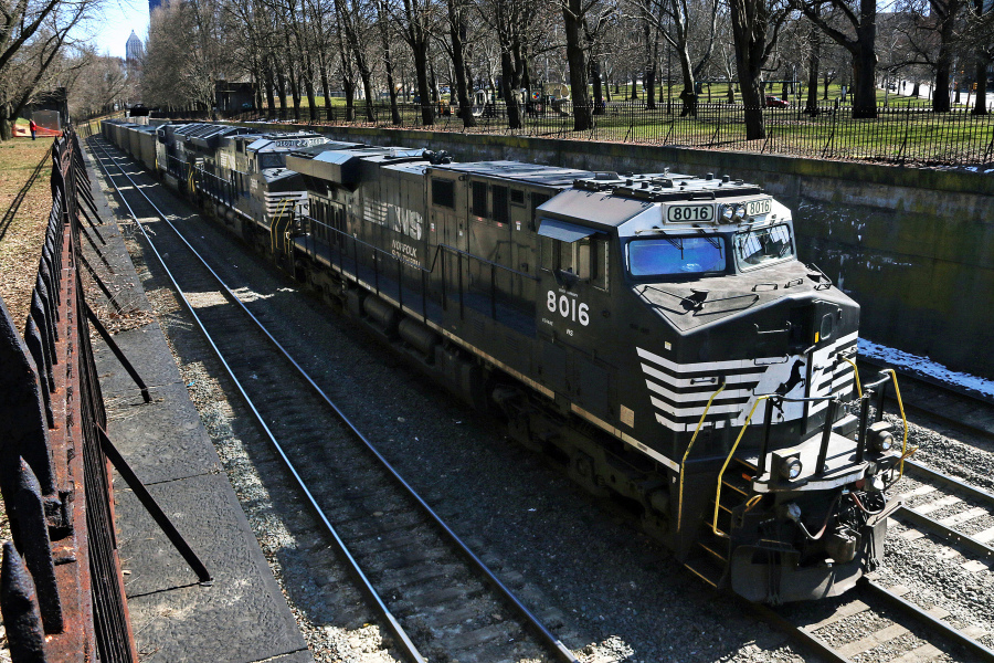FILE - A Norfolk Southern freight train rolls through downtown Pittsburgh, on March 26, 2018. Norfolk Southern became the first major freight railroad with deals to provide sick time to all of its workers Monday, June 5, 2023 but the other railroads are making progress with nearly 60% of all rail workers securing this basic benefit. All of the major freight railroads have said they're committed to resolving this key issue that nearly led to a strike last year. But most of those railroads are still negotiating with a number of their unions. (AP Photo/Gene J.