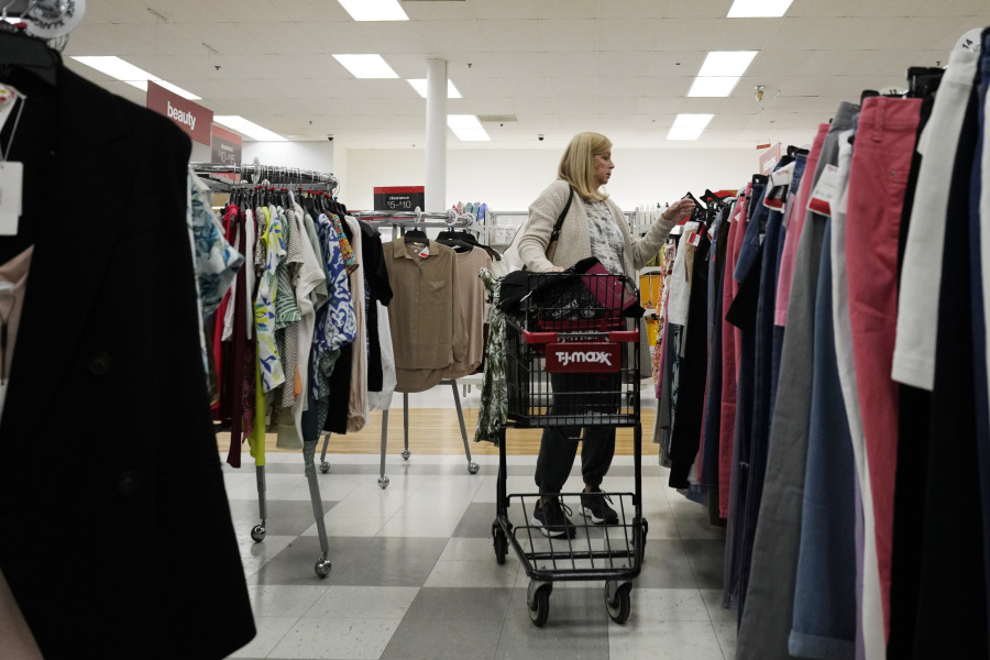 A customer checks prices while shopping at a retail store in Vernon Hills, Ill., Monday, June 12, 2023. On Thursday, the Commerce Department releases U.S. retail sales data for May. (AP Photo/Nam Y.