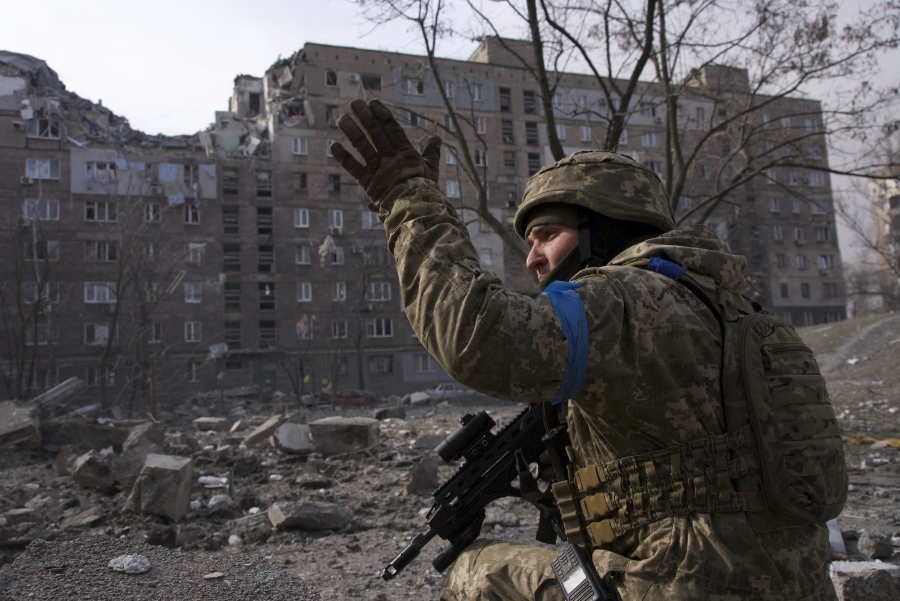 FILE - A Ukrainian serviceman guards his position in Mariupol, Ukraine, March 12, 2022. The award-winning film "20 Days in Mariupol" made its premiere in Ukraine on Saturday, June 3, 2023, seen for the first time by some of the Ukrainian medics and first responders who were chronicled in the documentary about how Russian forces bombed and blasted their way into the southeastern port city last year.