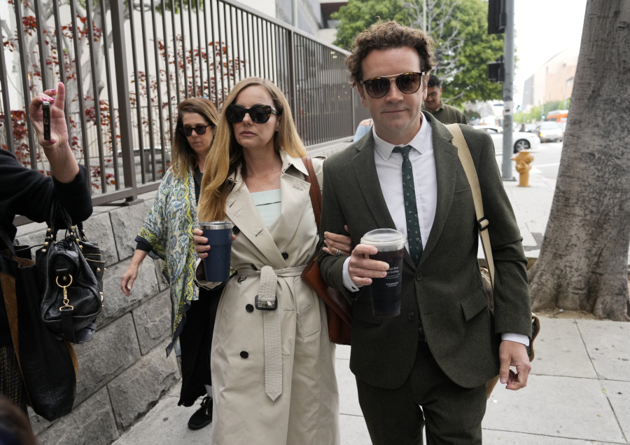FILE - Danny Masterson, right, and his wife Bijou Phillips arrive for closing arguments in his second trial, May 16, 2023, in Los Angeles. A jury found "That '70s Show" star Masterson guilty of two counts of rape Wednesday, May 31, in a Los Angeles retrial in which the Church of Scientology played a central role.