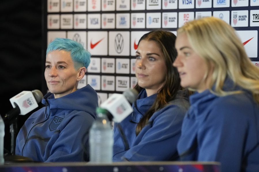 From left, Megan Rapinoe, Alex Morgan, and Lindsey Horan speak to reporters during the 2023 Women's World Cup media day for the United States Women's National Team in Carson, Tuesday, June 27, 2023.
