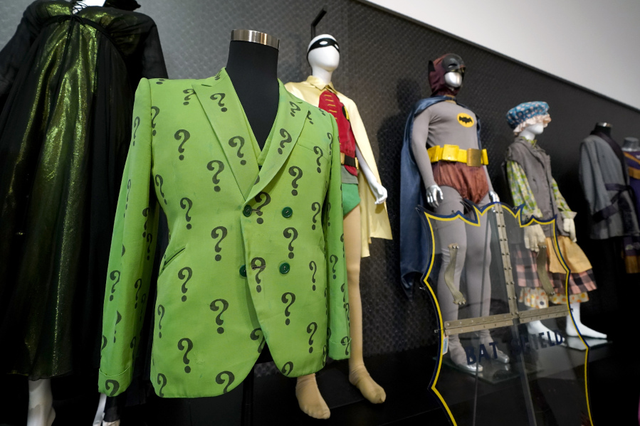 The Riddler's jacket and Batman and Robin's costumes are among items on display April 27 in Irving, Texas.
