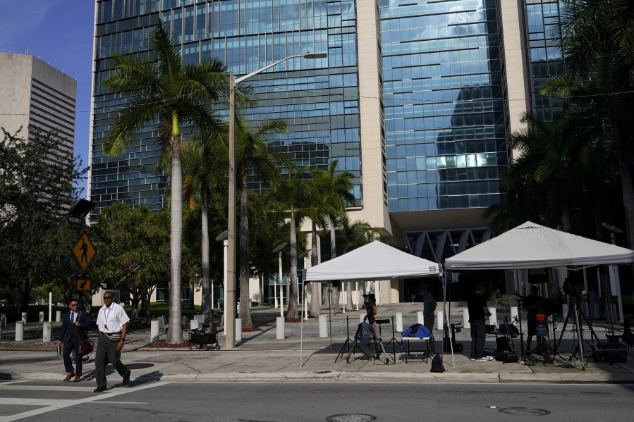News media are set up outside of the Wilkie D. Ferguson Jr. U.S. Courthouse where a grand jury is meeting, Wednesday, June 7, 2023, in Miami. Federal prosecutors are using a grand jury in Florida as part of an investigation into the possible mishandling of classified documents at former President Donald Trump's Palm Beach property, a personal familiar with the matter told The Associated Press.