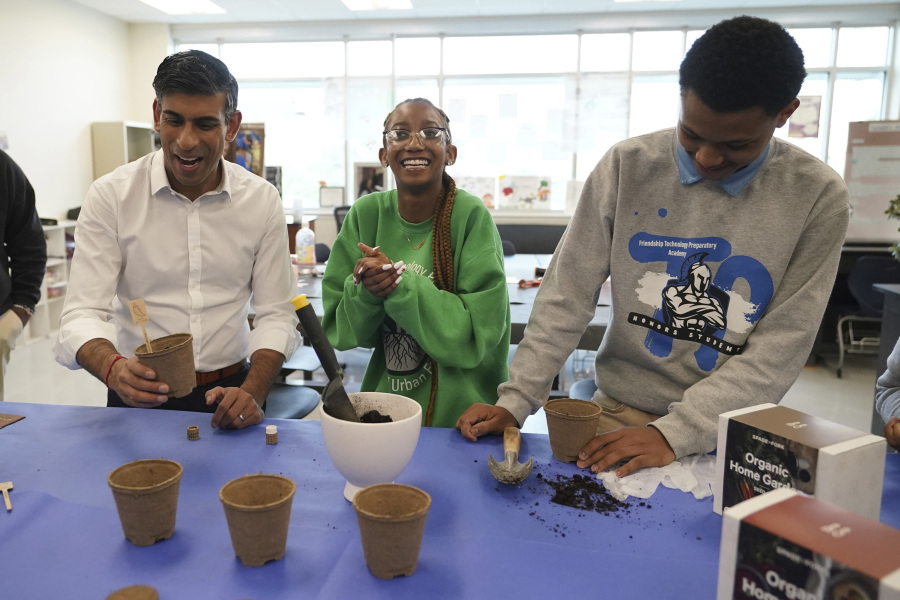 British Prime Minister Rishi Sunak plants some jalapeno seeds as he takes part in a sustainability class during a visit to the Friendship Technology Preparatory High School as part of his visit to Washington, Wednesday, June 7, 2023.