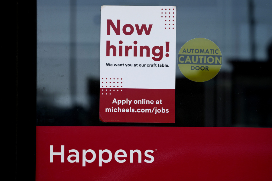 A hiring sign is displayed at a retail store in Downers Grove, Ill., Wednesday, April 12, 2023. On Thursday, the Labor Department reports on the number of people who applied for unemployment benefits last week.(AP Photo/Nam Y.