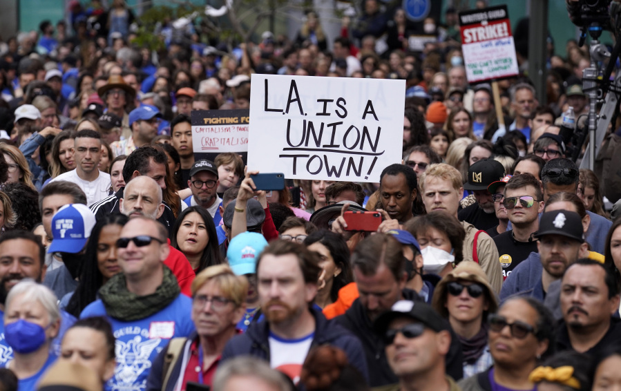 Crowd members listen to a speaker during the "Unions Strike Back" rally, Friday, May 26, 2023, near Crypto.com Arena in Los Angeles. Union members from the tourism and hospitality, Hollywood, public sector, education and logistics industries mobilized for a display of collective solidarity.