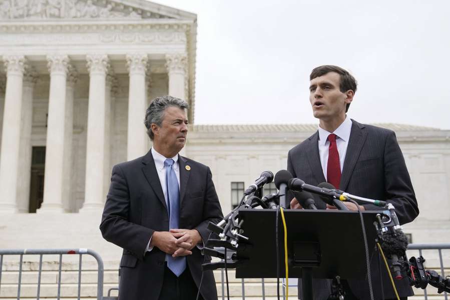 FILE - Alabama Solicitor General Edmund LaCour, right, speaks alongside Alabama Attorney General Steve Marshall following oral arguments in Merrill v. Milligan, an Alabama redistricting case that could have far-reaching effects on minority voting power across the United States, outside the Supreme Court on Capitol Hill in Washington, Oct. 4, 2022.