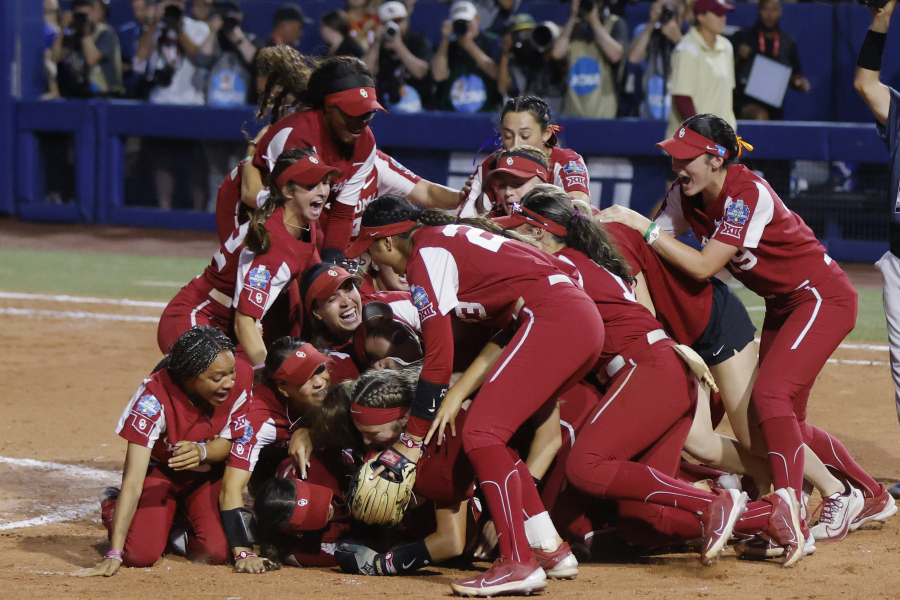 Oklahoma players celebrate after defeating Florida State in the NCAA Women's College World Series softball championship series Thursday, June 8, 2023, in Oklahoma City.