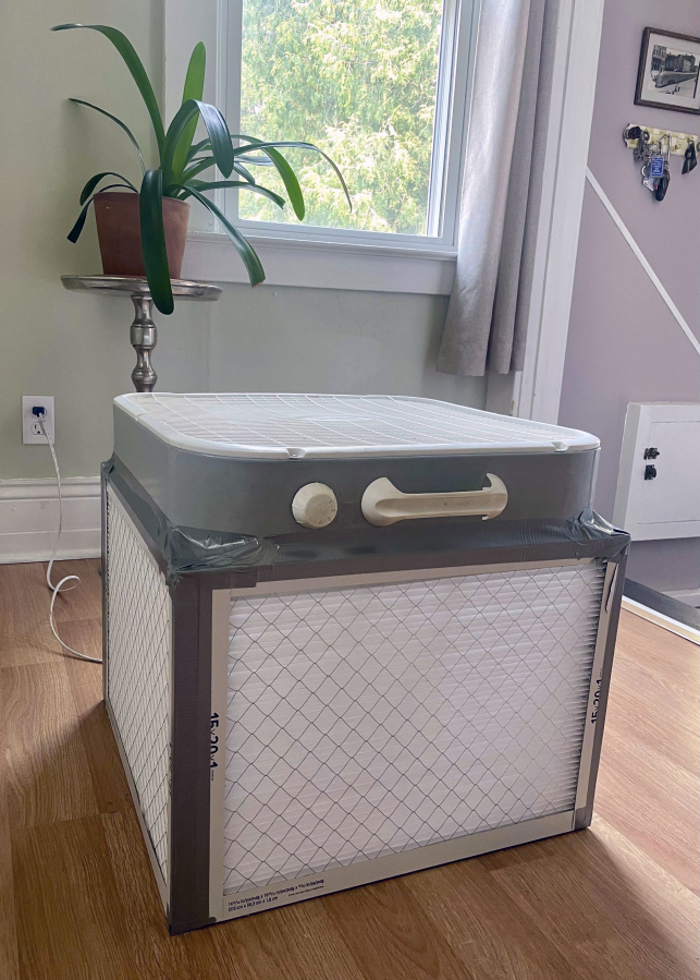 A Corsi-Rosenthal air purifier built by Liz Hradil is seen at her home in Syracuse, N.Y. after the wildfire smoke covered much of New York Wednesday, June 7, 2023. The method involves taping four air filters together with a box fan. Experts say the DIY method is highly effective against filtering air indoors against wildfire smoke.