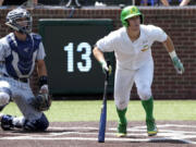 Oregon's Drew Cowley doubles against Xavier and drives in the winning run in the seventh inning during an NCAA regional college tournament baseball game on Friday June 2, 2023, in Nashville, Tenn. Oregon won 5-4.