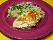 Caramelized Onion-Stuffed Chicken Breast with Spinach and Brown Rice.