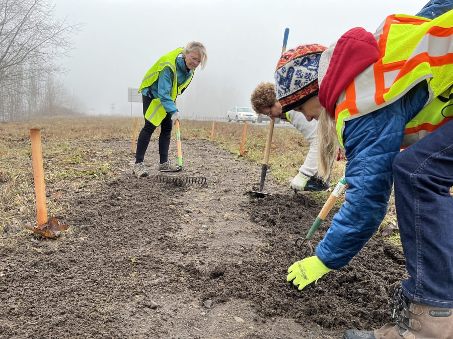 Melanie Wilson, left, and several East County Citizens Alliance  volunteers tend to a small "demonstration garden" in January on state Highway 14 close to the Washougal River Road roundabout.  Wilson is the founder of the group.