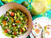 This piquant summer salad blends crunchy fresh veggies with creamy avocado and a tangy avocado dressing.