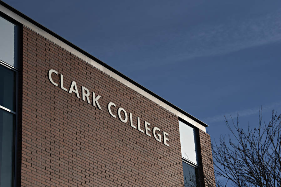 Morning sun illuminates a sign on a building at Clark College in January 2022.