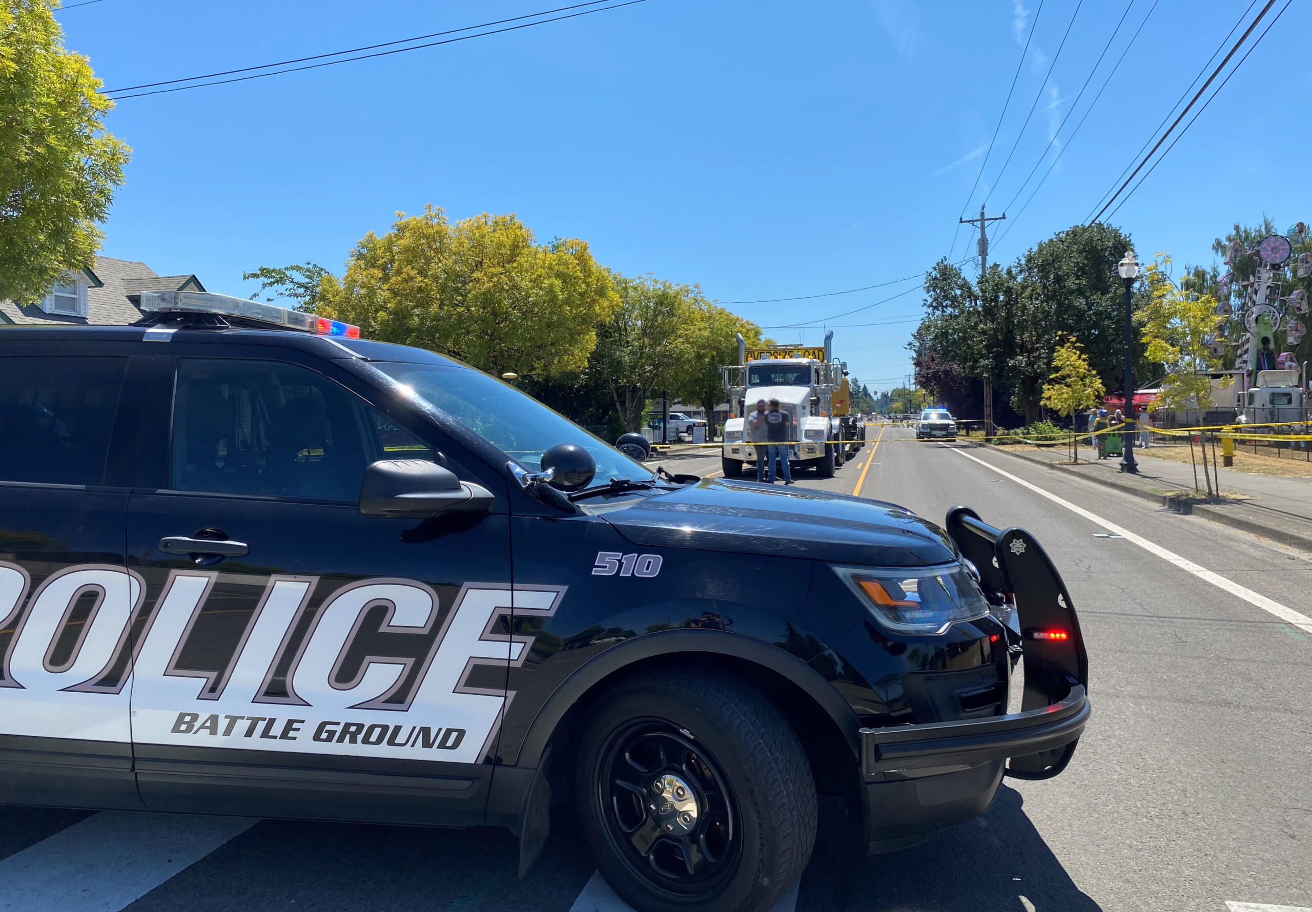 A Battle Ground police vehicle is parked at the scene of an incident that occurred during the Harvest Days Parade on Saturday, July 15, 2023, in Battle Ground.