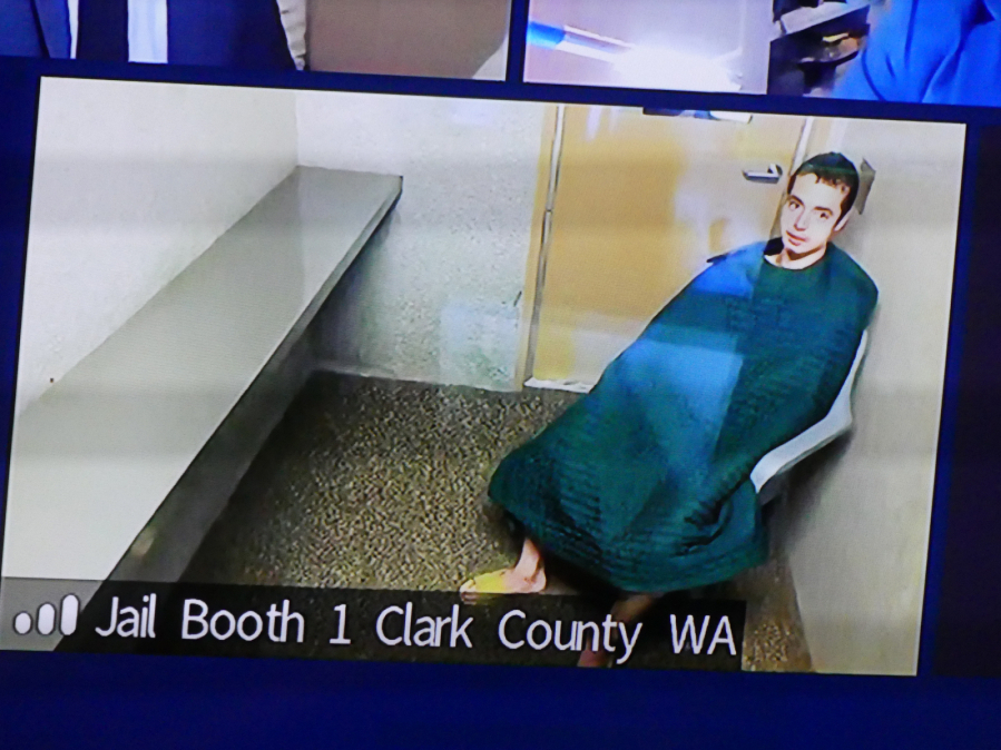 Hunter Alexander Levi, then 20, makes a first appearance in June 2021 in Clark County Superior Court. He was sentenced Wednesday to nearly six years in prison for sneaking up behind an employee at a towing business as she worked at her desk and stabbing her in the neck.