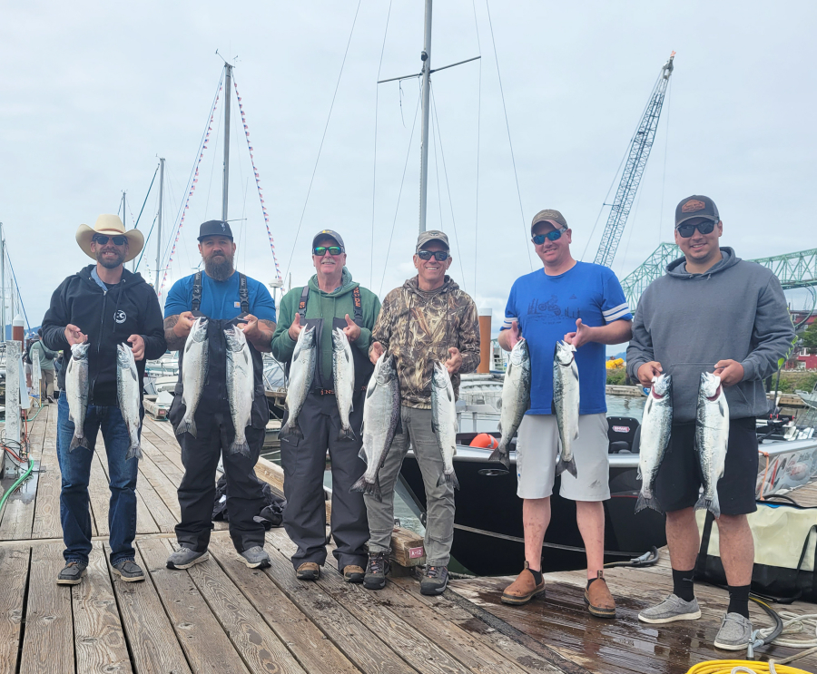 Happy clients of Team Hook-Up Guide Service pose in Astoria, Ore., with their fish. Last year?s fishery was cut short, but the WDFW is trying a different season structure to hopefully avoid a closure again this year.
