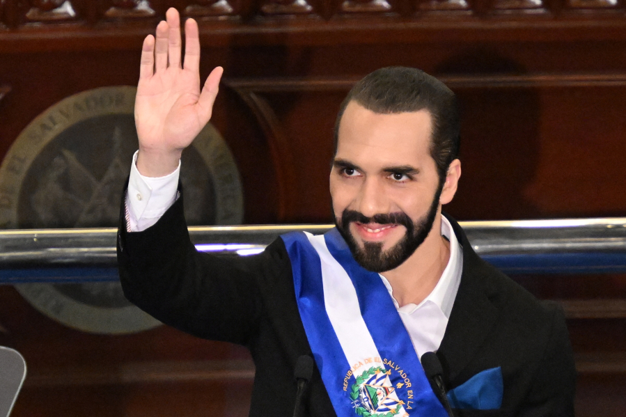 Salvadoran President Nayib Bukele waves after delivering his annual address to the nation marking his fourth year in office at the San Salvador Legislative Assembly on June 1, 2023.