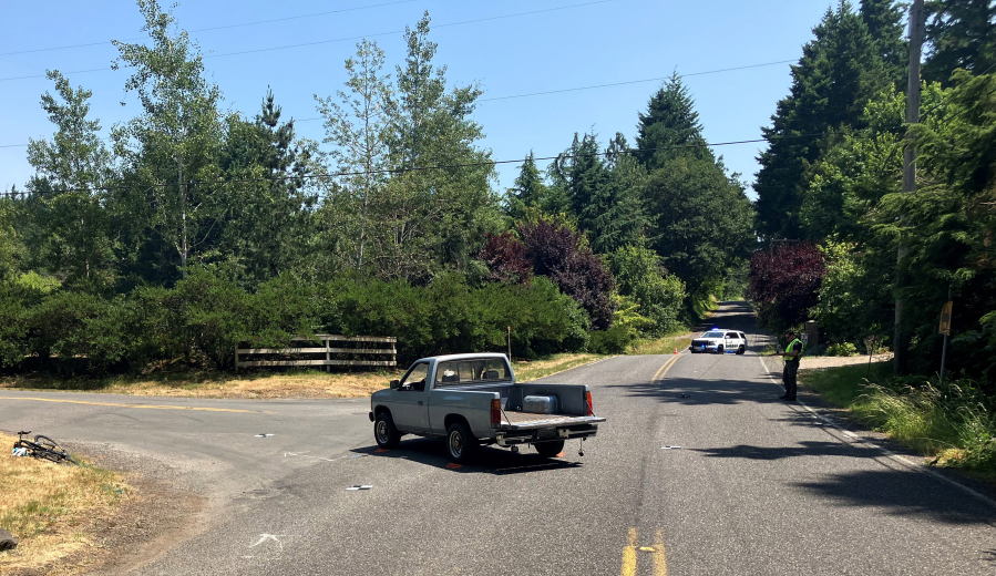 The scene of a Tuesday crash after Clark County sheriff's deputies say a pickup struck a bicyclist on Northwest 291st Street. Investigators arrested the driver of the pickup, a 60-year-old Ridgefield man, on suspicion of vehicular assault.