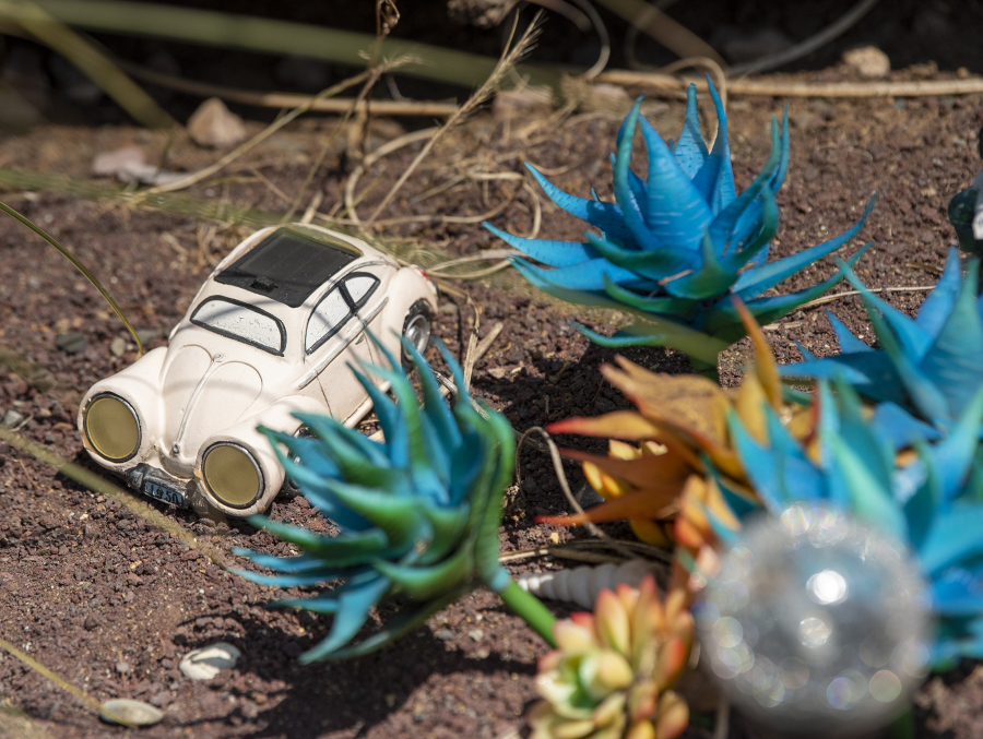 Toy cars sit among real and plastic plants at Jermaine Boddie's front yard in Hazel Dell.