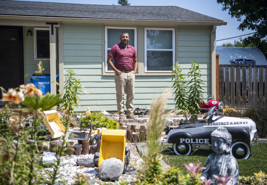 Jermaine Boddie surveys the sandbox of his dreams -- which he's created in his West Hazel Dell front yard -- on a recent afternoon. "My yard is basically an expression of my childhood.