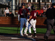 Corey Nunez and Jake Tsukada of The Ridgefield Raptors celebrate at home plate against The Bellingham Bells on Friday July 7th, 2023 at the Ridgefield Outdoor Recreation Complex.